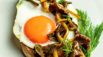 Sunny-Side Up in White Truffle Butter with Mushrooms on Toast